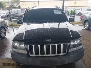 2004 Jeep Grand Cherokee Laredo with VIN 1J4GX48N94C435700, listed as a IAAI auction lot 41809624 with 147,413 mi miles. Bid and sale history available at carsss.com. Image 12.