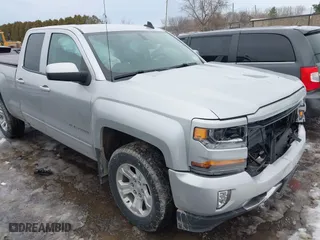 2018 Chevrolet Silverado 1500 LT with VIN 2GCVKREC5J1107722, listed as a IAAI auction lot 41695194 with 82,969 mi miles. Bid and sale history available at carsss.com. Image 1.