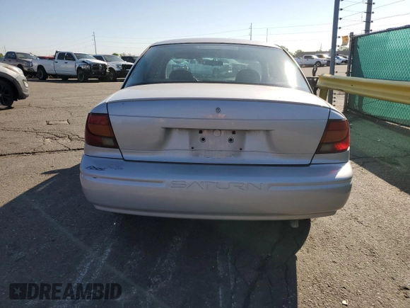 2001 Saturn SL z VIN 1G8ZH52891Z317279, wystawiony jako Copart lot #55163885 z przebiegiem 136 029 mil mil oraz Nie do naprawy • Non repairable. Historia ofert i sprzedaży dostępna na DreamBid. Obrazek 6.