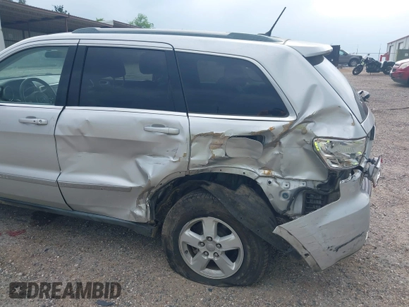 2011 Jeep Grand Cherokee Laredo with VIN 1J4RS4GGXBC564035, listed as a IAAI auction lot 41931861 with 242,291 mi miles and . Bid and sale history available at DreamBid. Image 6.