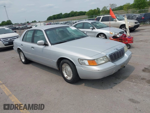 1999 Mercury Grand Marquis LS z VIN 2MEFM75W7XX659031, wystawiony jako IAAI lot #42362387 z przebiegiem 140 067 mil mil oraz . Historia ofert i sprzedaży dostępna na DreamBid. Obrazek 1.