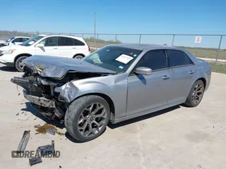 2018 Chrysler 300 with VIN 2C3CCABG2JH245095, listed as a IAAI auction lot 41827509 with 156,617 mi miles. Bid and sale history available at carsss.com. Image 2.