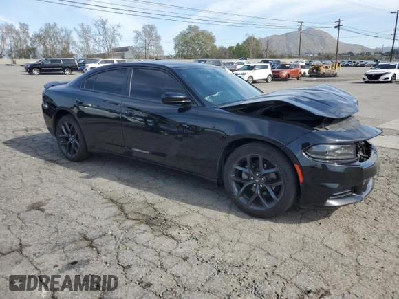 2021 Dodge Charger SXT with VIN 2C3CDXBG9MH682354, listed as a Copart auction lot 48586415 with 112,449 mi miles and Salvage Title. Bid and sale history available at carsss.com. Image 4.