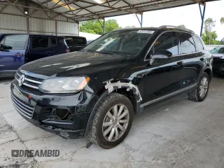 2011 Volkswagen Touareg Sport with VIN WVGFF9BP5BD000137, listed as a Copart auction lot 59157195 with 190,630 mi miles and Salvage title. Bid and sale history available at DreamBid. Image 1.