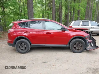 2016 Toyota RAV4 LE with VIN JTMZFREV4GJ062701, listed as a IAAI auction lot 42084694 with 121,553 mi miles and . Bid and sale history available at DreamBid. Image 14.