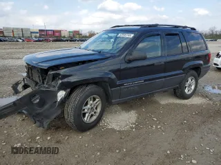 2004 Jeep Grand Cherokee Laredo with VIN 1J4GW48S84C184757, listed as a Copart auction lot 52895745 with 242,307 mi miles and Salvage Title. Bid and sale history available at carsss.com. Image 1.