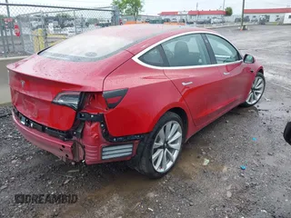 2018 Tesla Model 3 Long Range Battery with VIN 5YJ3E1EA6JF052659, listed as a IAAI auction lot 42093903 with 49,255 mi miles and . Bid and sale history available at DreamBid. Image 4.
