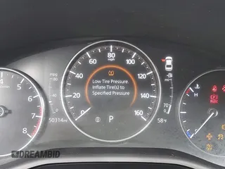 2022 Mazda 3 Carbon Edition z VIN 3MZBPACL2NM310491, wystawiony jako IAAI lot #41981966 z przebiegiem 50 314 mil mil oraz . Historia ofert i sprzedaży dostępna na DreamBid. Obrazek 16.