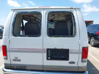 1999 Ford Econoline Cargo Recreational with VIN 1FDRE14L2XHA41059, listed as a IAAI auction lot 42067879 with 149,185 mi miles. Bid and sale history available at carsss.com. Image 18.