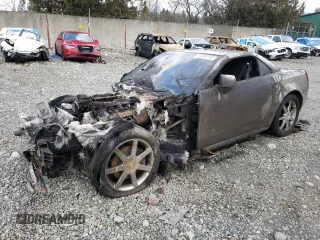 2004 Cadillac XLR z VIN 1G6YV34AX45601257, wystawiony jako Copart lot #44490755 z przebiegiem Nie podano mil oraz Szkody całkowita. Historia ofert i sprzedaży dostępna na DreamBid. Obrazek 1.