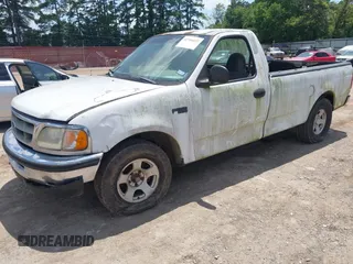 1998 Ford F-150 with VIN 1FTZF1724WKB57921, listed as a IAAI auction lot 42706692 with 213,913 mi miles and . Bid and sale history available at DreamBid. Image 2.