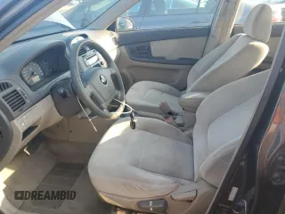 2006 Kia Spectra EX with VIN KNAFE122X65270684, listed as a Copart auction lot 73002454 with 79,326 mi miles and Salvage Title. Bid and sale history available at carsss.com. Image 7.