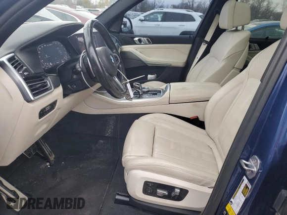 2020 BMW X5 M50i with VIN 5UXJU4C07LLE46002, listed as a Copart auction lot 77853984 with 74,098 mi miles and Salvage Title. Bid and sale history available at DreamBid. Image 7.