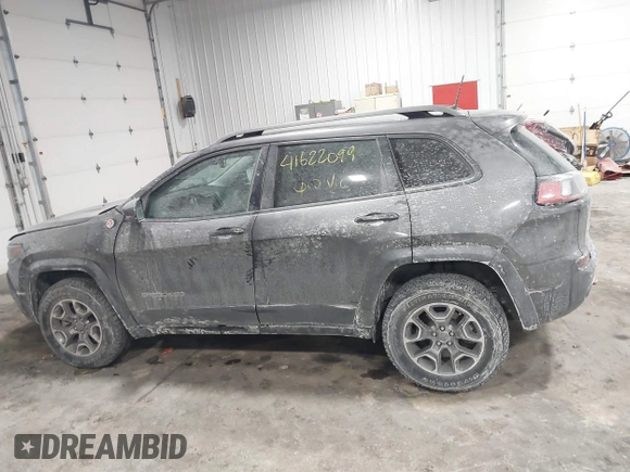 2021 Jeep Cherokee Trailhawk z VIN 1C4PJMBX4MD148597, wystawiony jako IAAI lot #41622099 z przebiegiem 48 452 mil mil oraz . Historia ofert i sprzedaży dostępna na DreamBid. Obrazek 14.