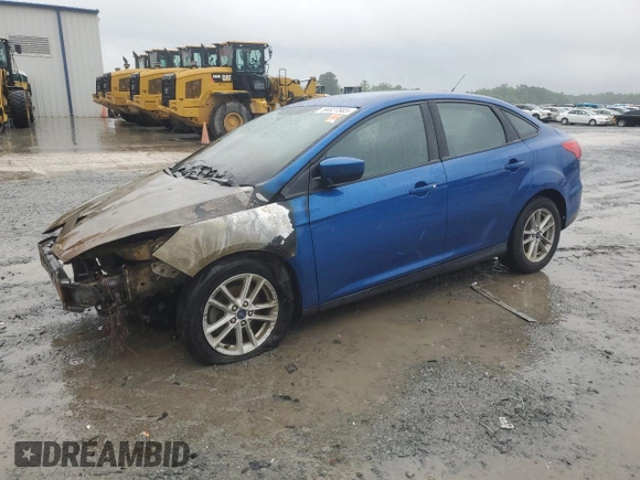 2018 Ford Focus SE z VIN 1FADP3FE6JL227653, wystawiony jako Copart lot #56827585 z przebiegiem Nie podano mil oraz Szkoda całkowita • Salvage title. Historia ofert i sprzedaży dostępna na DreamBid. Obrazek 1.