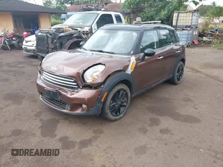 2014 MINI Countryman with VIN WMWZB3C51EWR36737, listed as a IAAI auction lot 41741248 with 69,717 mi miles and . Bid and sale history available at DreamBid. Image 2.
