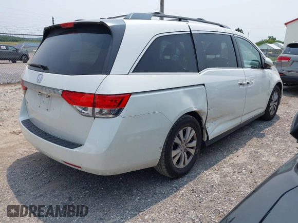 2014 Honda Odyssey EX-L with VIN 5FNRL5H62EB109573, listed as a IAAI auction lot 42387637 with 208,061 mi miles and . Bid and sale history available at DreamBid. Image 4.