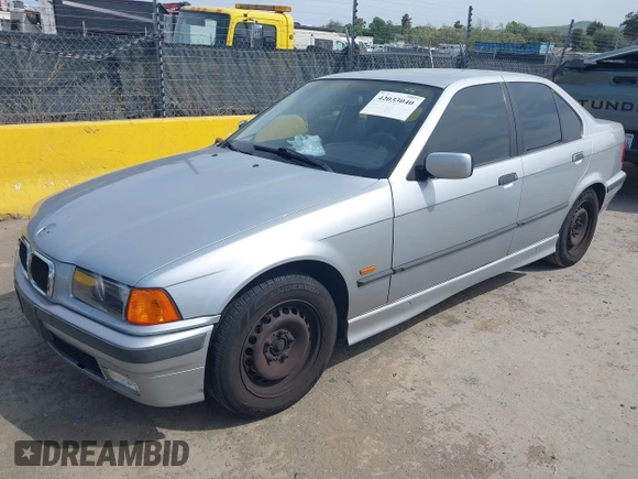 1997 BMW 3 Series 318iA with VIN WBACC0322VEK25478, listed as a IAAI auction lot 42033040 with 212,320 mi miles. Bid and sale history available at carsss.com. Image 2.