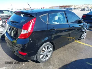 2015 Hyundai Accent Sport with VIN KMHCU5AE8FU233131, listed as a IAAI auction lot 41360461 with 99,480 mi miles. Bid and sale history available at carsss.com. Image 4.