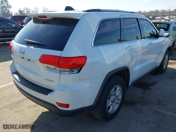 2014 Jeep Grand Cherokee Laredo with VIN 1C4RJEAGXEC130399, listed as a IAAI auction lot 41861664 with 106,925 mi miles. Bid and sale history available at carsss.com. Image 4.