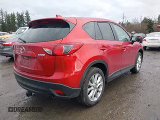 2015 Mazda CX-5 Grand Touring with VIN JM3KE4DY0F0479392, listed as a IAAI auction lot 41659415 with 141,403 mi miles. Bid and sale history available at carsss.com. Image 4.