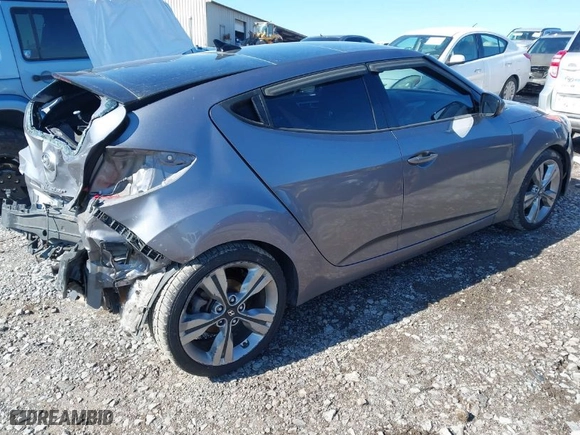 2016 Hyundai Veloster with VIN KMHTC6AD9GU264048, listed as a IAAI auction lot 41634443 with 103,758 mi miles. Bid and sale history available at carsss.com. Image 4.