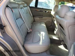 2001 Cadillac DeVille DHS z VIN 1G6KE57Y21U250470, wystawiony jako Copart lot #57334785 z przebiegiem 66 703 mil mil oraz Tytuł czysty. Historia ofert i sprzedaży dostępna na DreamBid. Obrazek 10.
