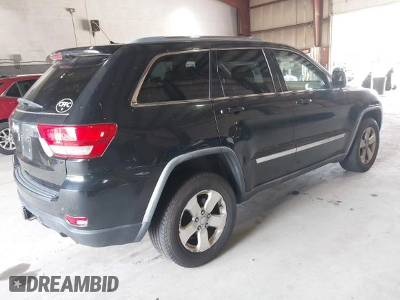 2012 Jeep Grand Cherokee Laredo with VIN 1C4RJFAT8CC182128, listed as a IAAI auction lot 40154044 with 239,601 mi miles. Bid and sale history available at carsss.com. Image 4.
