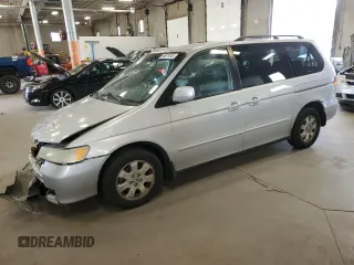 2004 Honda Odyssey EX-L with VIN 5FNRL18074B045243, listed as a Copart auction lot 65671545 with 296,129 mi miles and Salvage title. Bid and sale history available at DreamBid. Image 1.