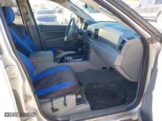 2005 Jeep Grand Cherokee Laredo with VIN 1J4HR48N65C537469, listed as a IAAI auction lot 41676555 with 226,084 mi miles. Bid and sale history available at carsss.com. Image 5.
