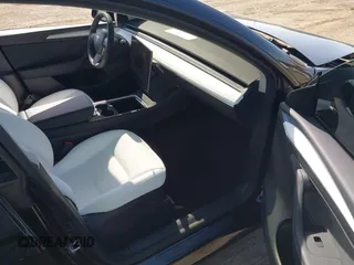 2025 Tesla Model Y Long Range with VIN 7SAYGDEEXSF267888, listed as a IAAI auction lot 41807129 with 3,002 mi miles and . Bid and sale history available at DreamBid. Image 5.