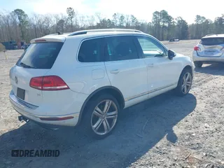 2016 Volkswagen Touareg Sport with VIN WVGEF9BP5GD012680, listed as a IAAI auction lot 41610943 with 153,952 mi miles and . Bid and sale history available at DreamBid. Image 4.
