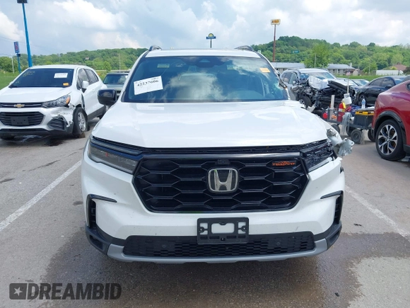 2024 Honda Pilot TrailSport z VIN 5FNYG1H6XRB004763, wystawiony jako IAAI lot #42237606 z przebiegiem 14 819 mil mil oraz . Historia ofert i sprzedaży dostępna na DreamBid. Obrazek 12.