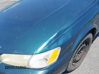 1998 Toyota Camry LE z VIN 4T1BF22K1WU927328, wystawiony jako IAAI lot #42534974 z przebiegiem 74 368 mil mil oraz . Historia ofert i sprzedaży dostępna na DreamBid. Obrazek 12.