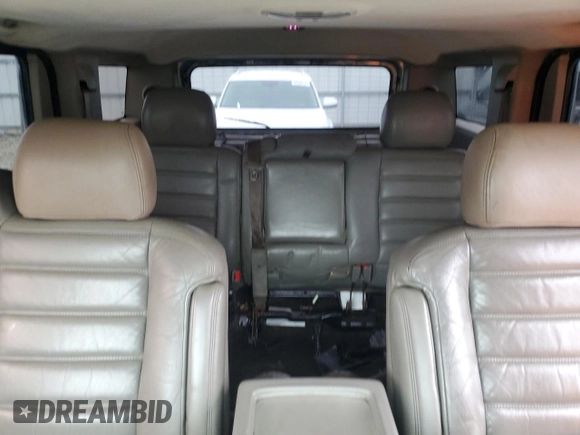 2004 Hummer H2 with VIN 5GRGN23U24H118230, listed as a Copart auction lot 87764075 with 202,206 mi miles and Salvage Title. Bid and sale history available at carsss.com. Image 10.