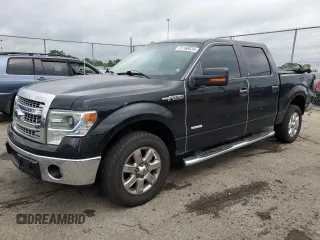 2014 Ford F-150 XL with VIN 1FTFW1CT8EFA76199, listed as a Copart auction lot 61168535 with 129,737 mi miles and Salvage title. Bid and sale history available at DreamBid. Image 1.
