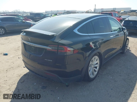2019 Tesla Model X 75D with VIN 5YJXCBE22KF184504, listed as a IAAI auction lot 41802023 with 137,094 mi miles. Bid and sale history available at carsss.com. Image 4.