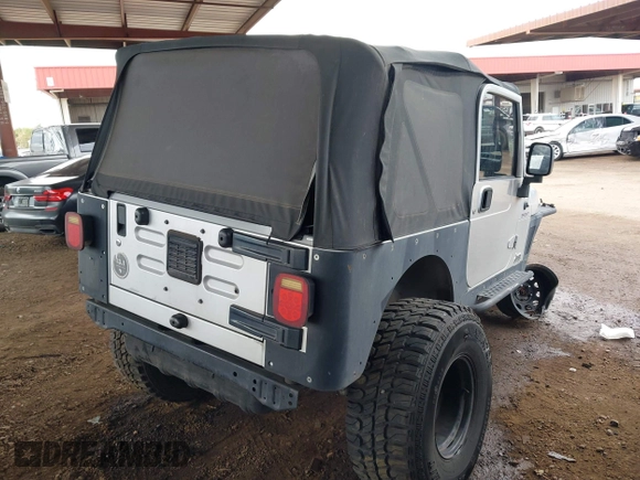2006 Jeep Wrangler Sport with VIN 1J4FA49S46P748604, listed as a IAAI auction lot 41788157 with 128,249 mi miles. Bid and sale history available at carsss.com. Image 4.