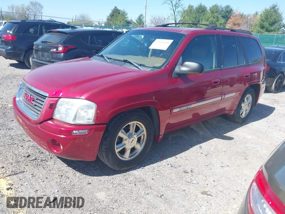 2002 GMC Envoy SLT with VIN 1GKDS13S922205147, listed as a IAAI auction lot 42041118 with 127,400 mi miles. Bid and sale history available at carsss.com. Image 2.