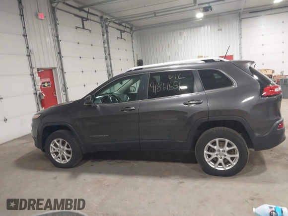 2014 Jeep Cherokee Altitude with VIN 1C4PJMCB2EW317346, listed as a IAAI auction lot 41861651 with 100,602 mi miles. Bid and sale history available at carsss.com. Image 14.