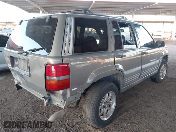 1998 Jeep Grand Cherokee Laredo with VIN 1J4GZ58S9WC136684, listed as a IAAI auction lot 41444103 with 1 mi miles. Bid and sale history available at carsss.com. Image 4.