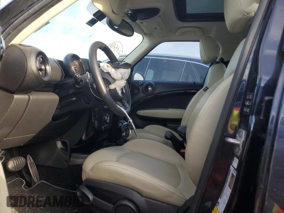 2015 MINI Countryman S with VIN WMWZC5C57FWP48606, listed as a Copart auction lot 47212255 with 104,922 mi miles and Salvage Title. Bid and sale history available at DreamBid. Image 7.