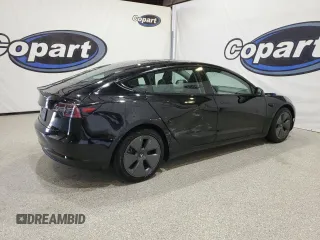 2023 Tesla Model 3 with VIN 5YJ3E1EA4PF452809, listed as a Copart auction lot 63688885 with 125,442 mi miles and Clean title. Bid and sale history available at DreamBid. Image 3.