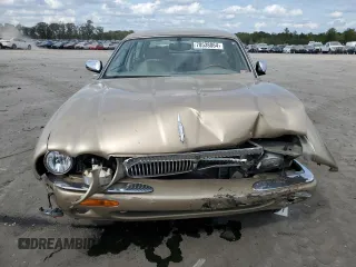 1999 Jaguar XJ z VIN SAJKX6048XC849376, wystawiony jako Copart lot #70538064 z przebiegiem 122 891 mil mil oraz Szkoda całkowita • Salvage title. Historia ofert i sprzedaży dostępna na DreamBid. Obrazek 5.