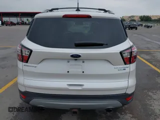 2018 Ford Escape Titanium with VIN 1FMCU9J98JUB87867, listed as a IAAI auction lot 42300123 with 48,357 mi miles and . Bid and sale history available at DreamBid. Image 16.