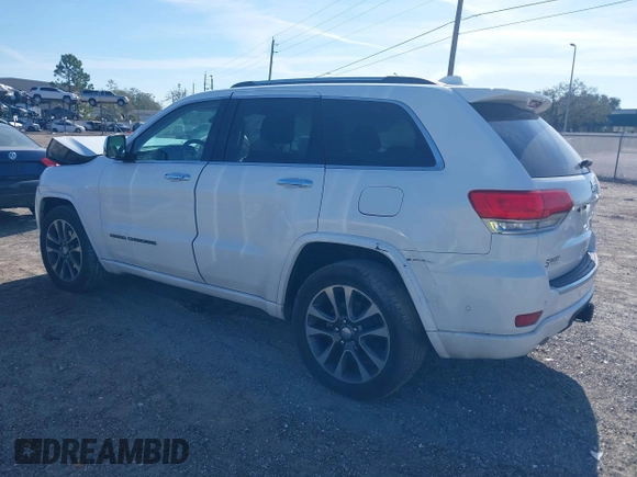 2017 Jeep Grand Cherokee Overland z VIN 1C4RJECG5HC959981, wystawiony jako IAAI lot #41638958 z przebiegiem 102 122 mil mil oraz . Historia ofert i sprzedaży dostępna na DreamBid. Obrazek 3.