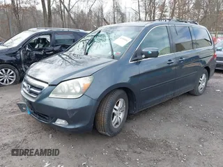 2005 Honda Odyssey EX-L with VIN 5FNRL38645B008281, listed as a IAAI auction lot 41985052 with 219,693 mi miles. Bid and sale history available at carsss.com. Image 2.