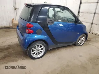 2009 Smart fortwo Pure z VIN WMEEJ31X99K209790, wystawiony jako Copart lot #51102685 z przebiegiem 30 389 mil mil oraz Szkody całkowita. Historia ofert i sprzedaży dostępna na DreamBid. Obrazek 3.
