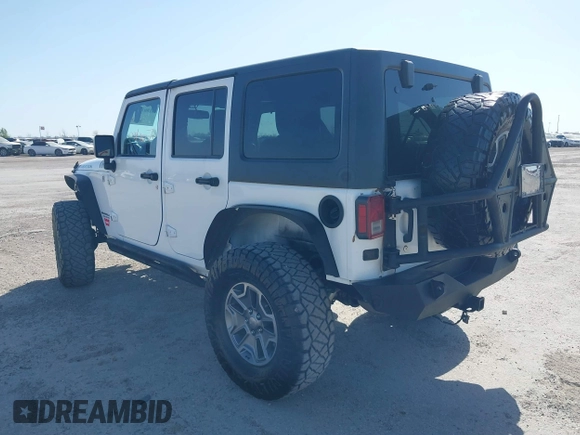2014 Jeep Wrangler Unlimited Rubicon with VIN 1C4BJWFG1EL167423, listed as a IAAI auction lot 41861109 with 104,669 mi miles. Bid and sale history available at carsss.com. Image 3.