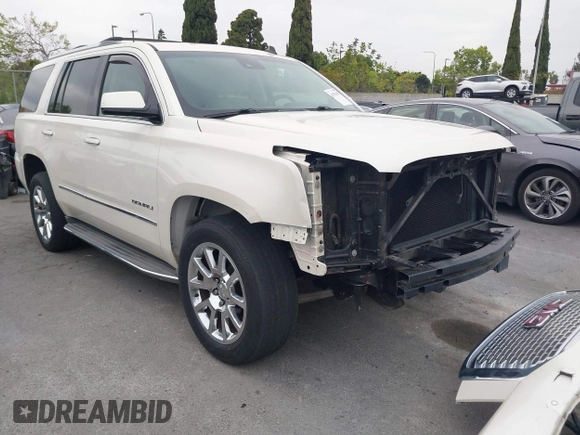 2015 GMC Yukon Denali with VIN 1GKS2CKJ9FR294551, listed as a IAAI auction lot 42162654 with 106,063 mi miles. Bid and sale history available at carsss.com. Image 1.